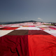 Illustration for article titled The Worlds Biggest Picnic Blanket Is Growing in the Swiss Countryside
